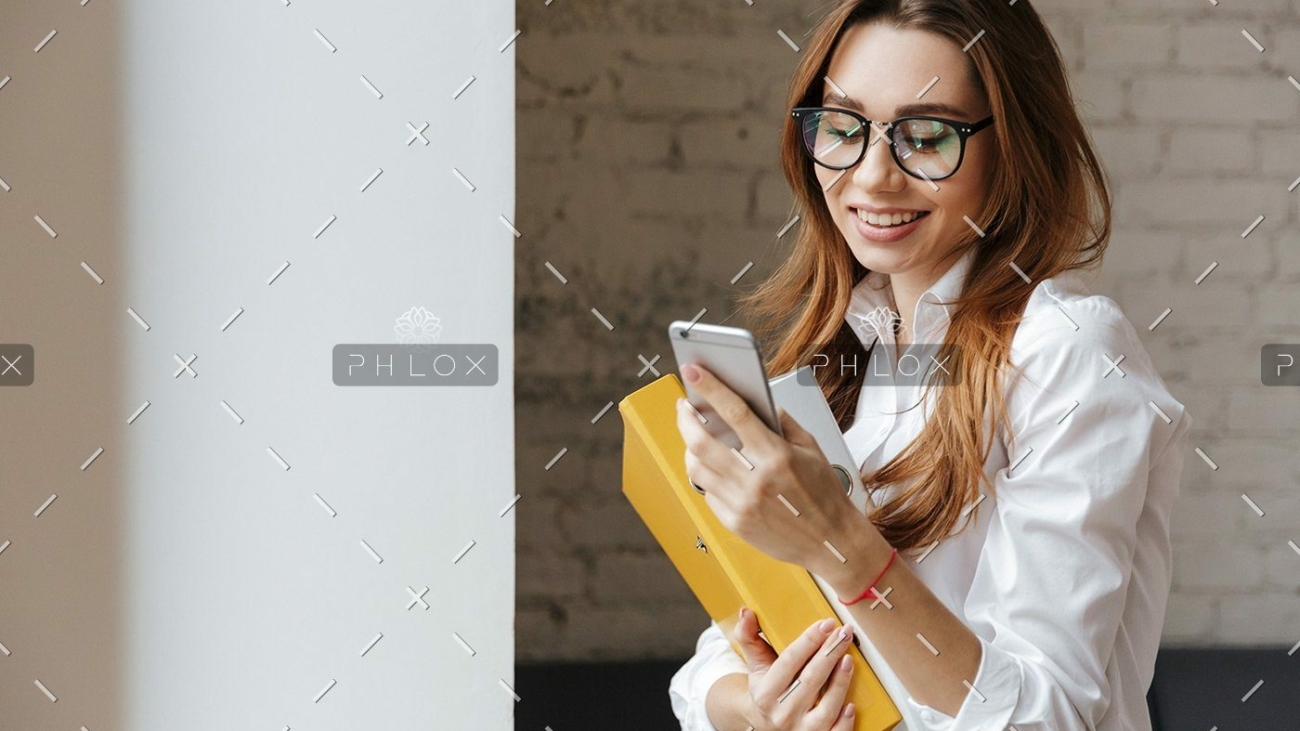 demo-attachment-175-happy-business-woman-indoors-using-mobile-phone-P9WS3SD